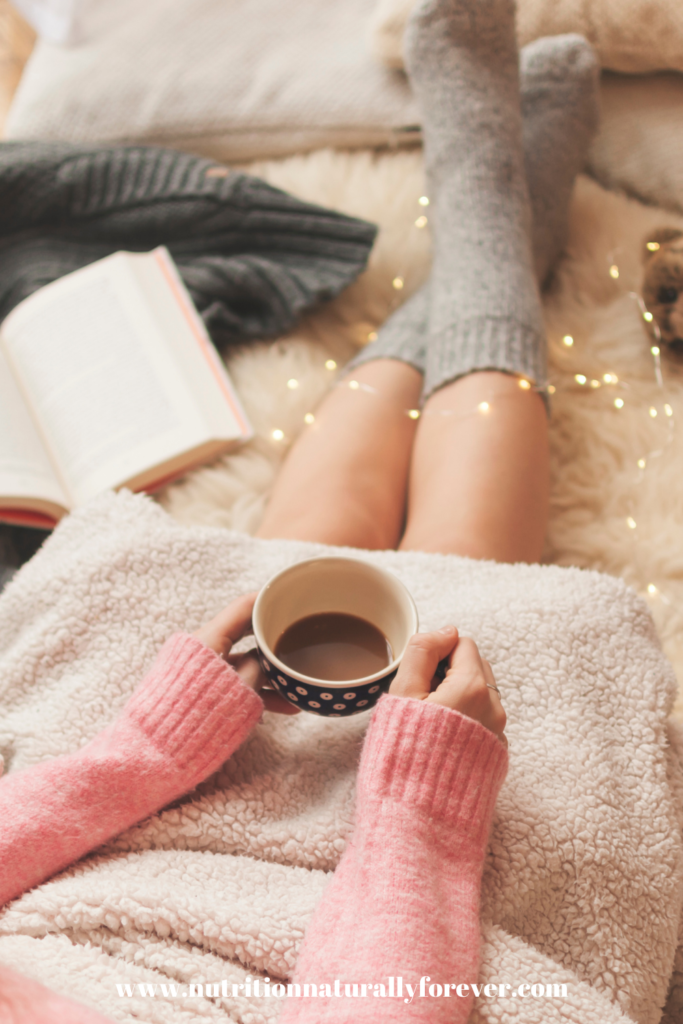 Cosy higgle with warm drinks and a book.